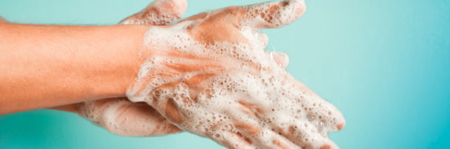 closeup of person washing hands