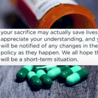 Bottle of spilled green pills on a gray background with text overtop that reads: your sacrifice may actually save lives," the note told Dale. "We appreciate your understanding, and you will be notified of any changes in the policy as they happen. We all hope this will be a short-term situation."