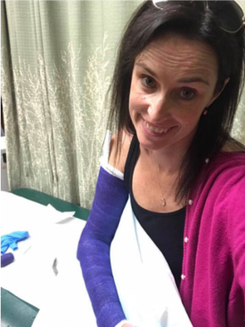 Melissa with her arm in a cast. Photo credit: Melissa Emerson.