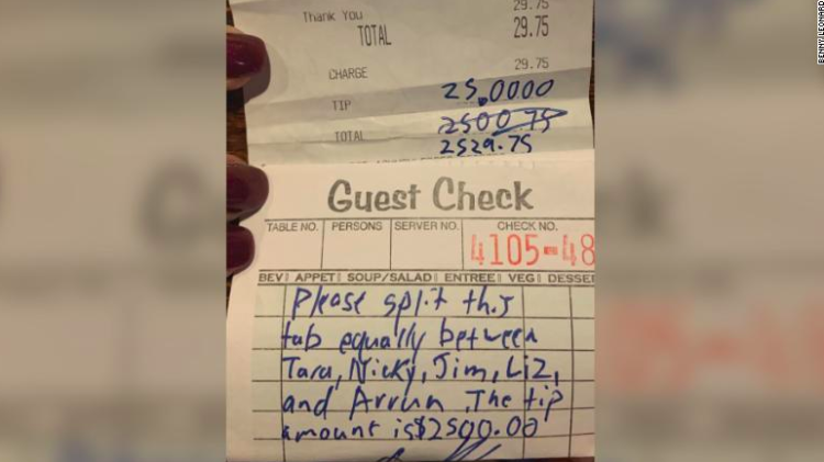 A bill with a $2,500 tip with instructions split between waitstaff