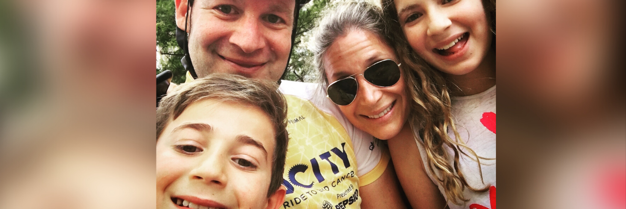 How I Attacked Colorectal Cancer to Ensure It Did Not Attack Me doug and his wife and two kids, doug is wearing a bike helmet