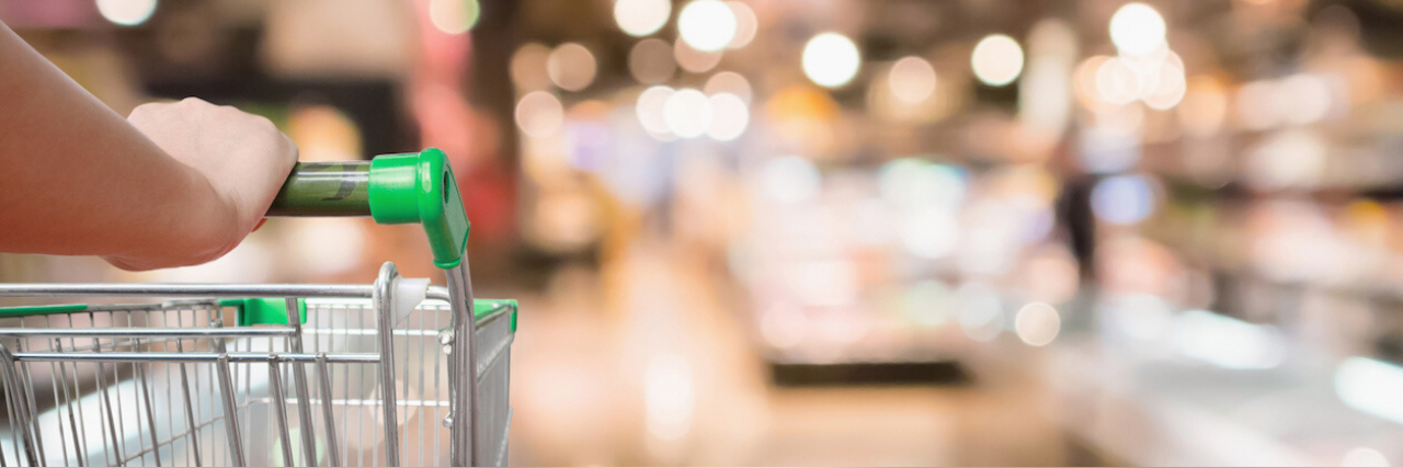 Dealing With Coronavirus Fear When You Have an Anxiety Disorder Person pushing a shopping cart into a grocery store