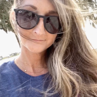 selfie of author in sunglasses smiling
