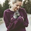 photo of a woman holding a kitten