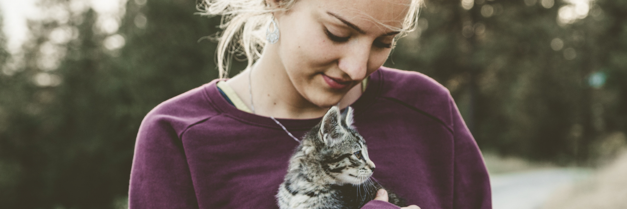 Seeing an Ex and Feeling Unlovable With Depression and Anxiety photo of a woman holding a kitten