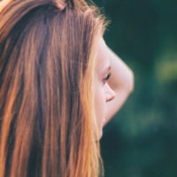 Profile of young woman looking into the distance