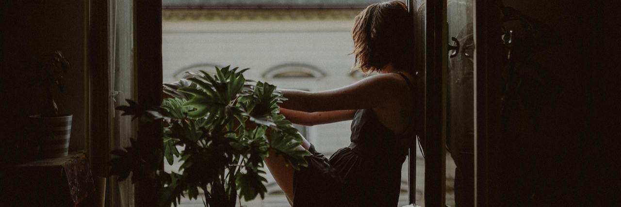 To People Who Feel Purposeless During the Coronavirus Pandemic A woman looking out the window