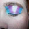 photo of person wearing trans flag eyeshadow