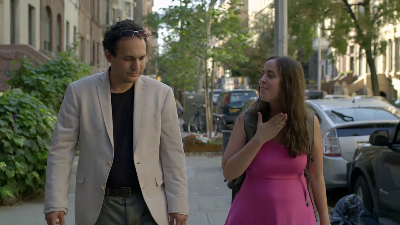 Screenshot from "Keep the Change" featuring two autistic people on a date.