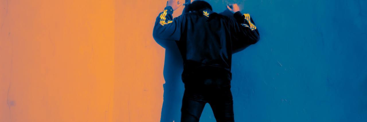 It's OK to Be Angry About Your Mental Illness During COVID-19 Pandemic man angrily beating hands against a wall