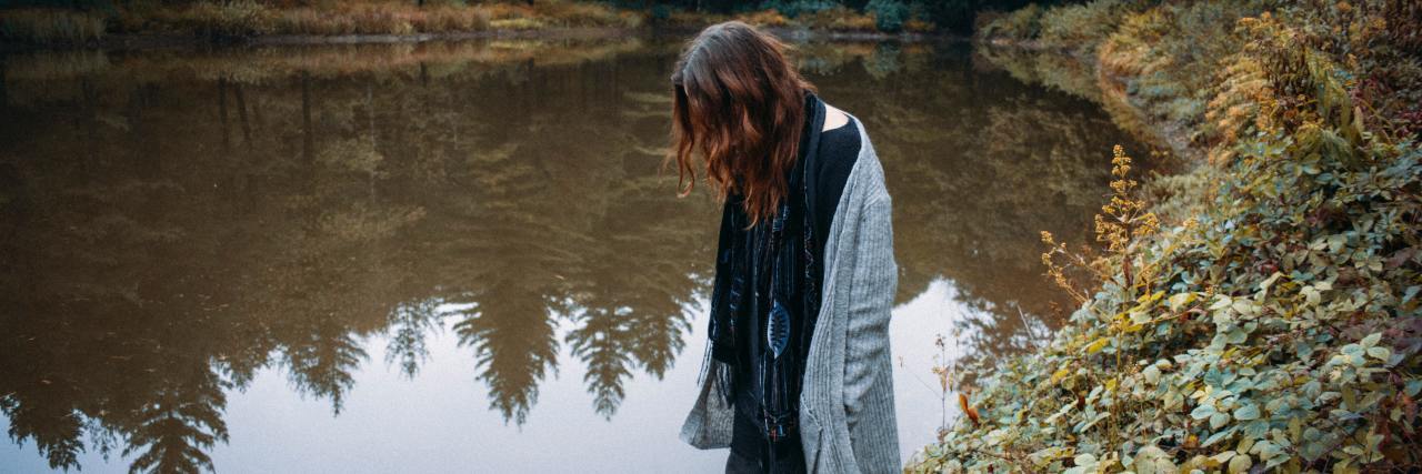 I'm Not Trying to be 'Rude' or 'Impolite' — I Have Anxiety woman standing by a lake, looking down