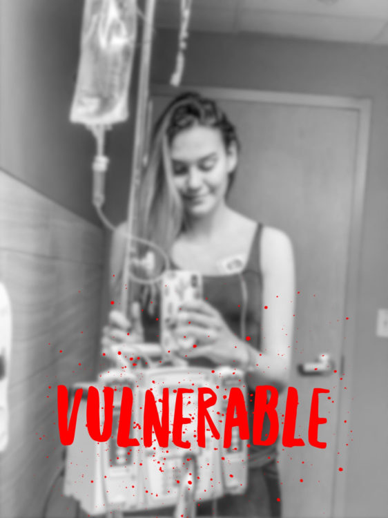  A woman with an IV pole. The word VULNERABLE is over her