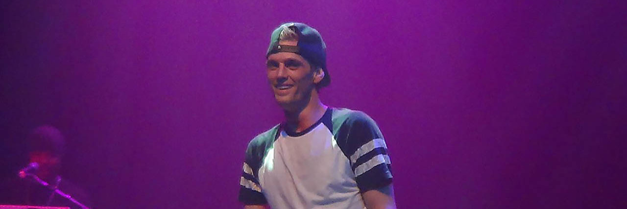 Aaron Carter poses while onstage at one of his concerts