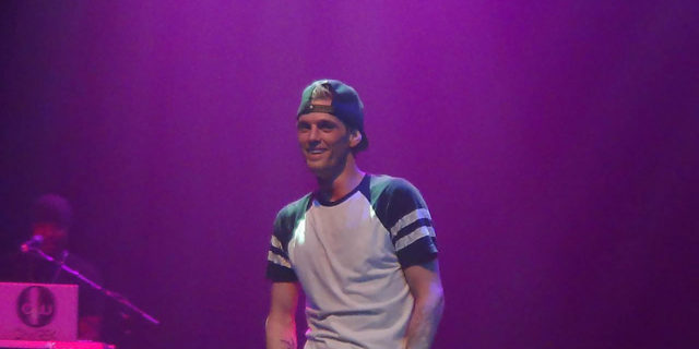 Aaron Carter poses while onstage at one of his concerts