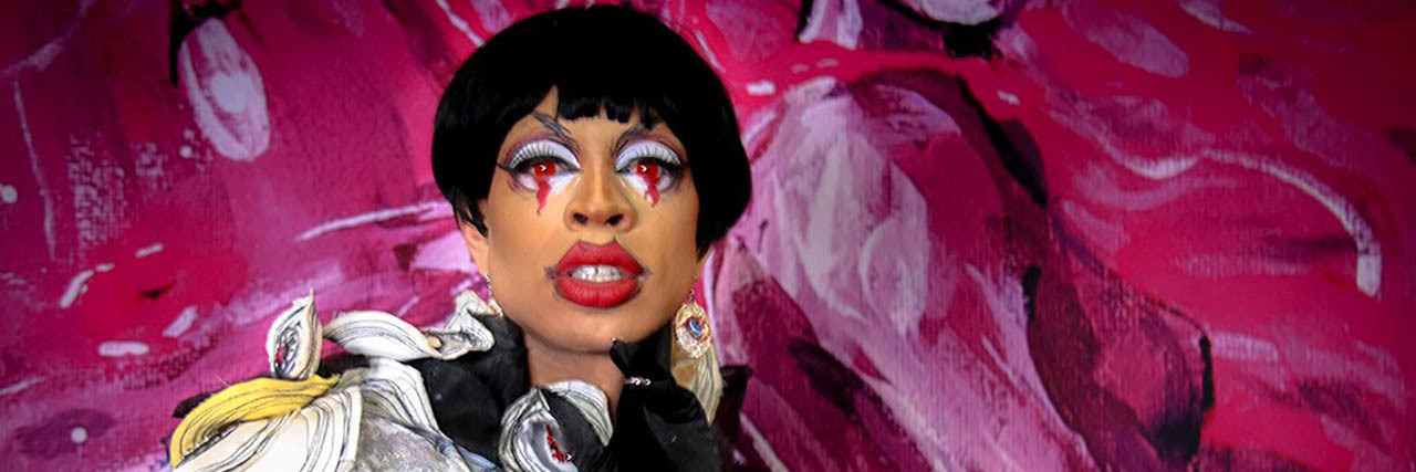 'Drag Race' Queen Yvie Oddly Shares How EDS Impacts Fan Interactions Yvie Oddly poses while in drag in front of a pink wall