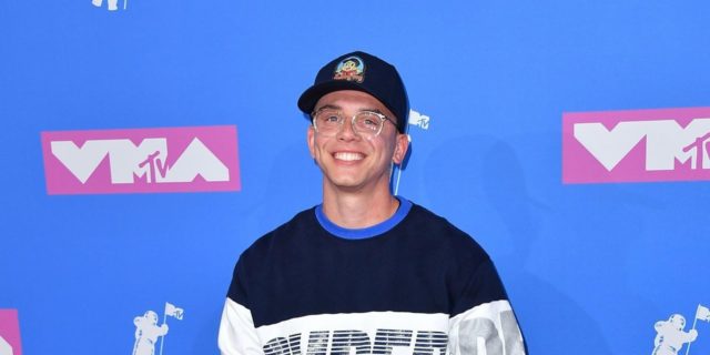 Logic's Grammy Performance Put Suicide Attempt and Loss Survivors on a National Stage Rapping Logic on the red carpet