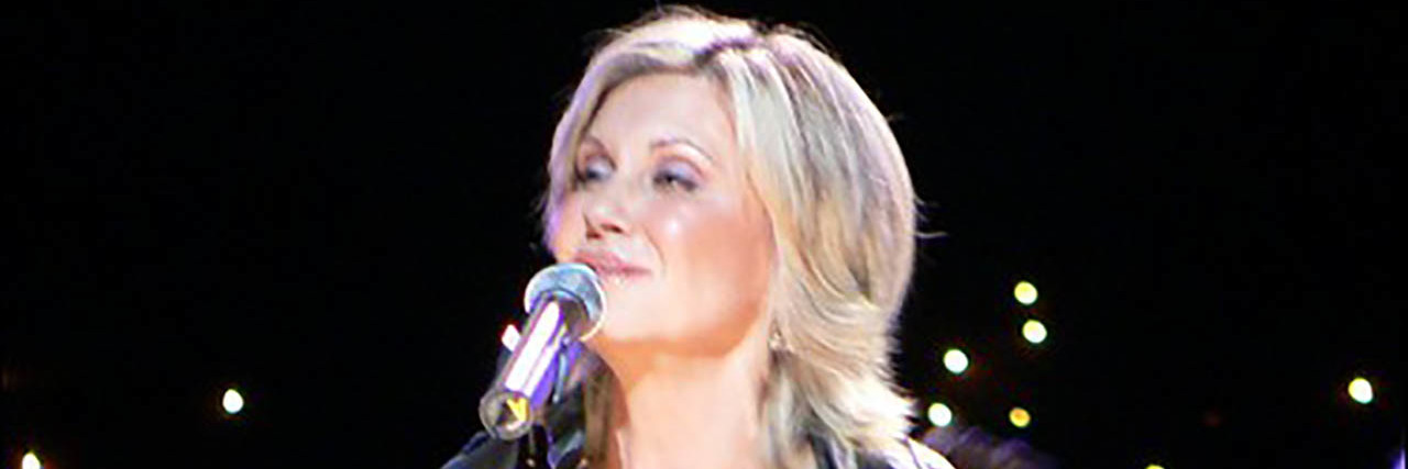 Olivia Newton-John Supports Medical Marijuana, Uses It as Part of Her Cancer Care Olivia Newton-John performs onstage in a gold ensemble