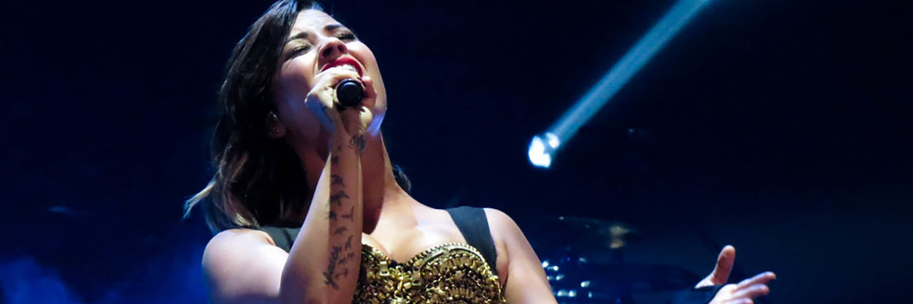Demi Lovato Has Reportedly Checked Out of Rehab After 90 Days Sober Demi Lovato singing onstage while wearing a black and gold ensemble