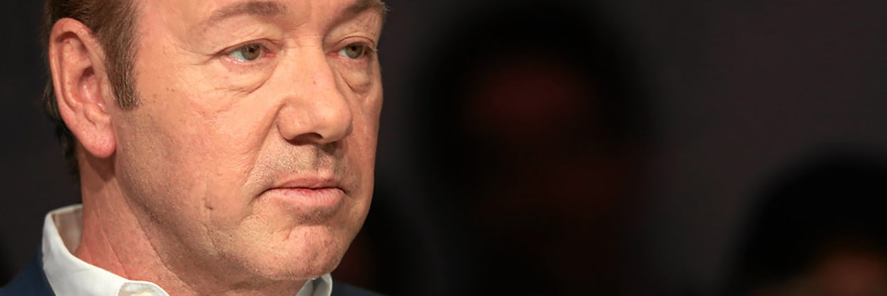 Why We Need to Call Out Old Sexual Assaults Like Kevin Spacey's Kevin Spacey raises his hands defensively while talking to a moderator on panel