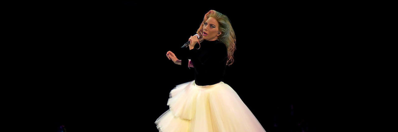 Lady Gaga Calls Suicidal Ideation a 'Spell' in Acceptance Speech Lady Gaga sings onstage in a black and white gown