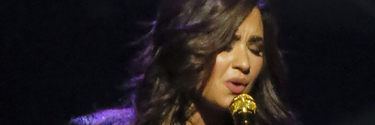 Demi Lovato Debuts 'Anyone,' a Song She Wrote 4 Days Before Her Overdose, at the 2020 Grammys Demi Lovato singing onstage while wearing a black outfit