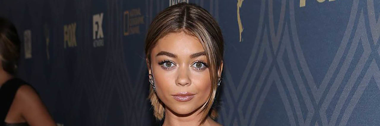 Sarah Hyland wears a leather dress on the red carpet