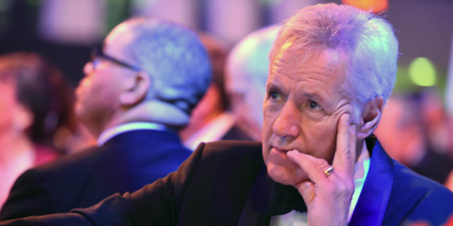 Alex Trebek Shares 'Mind-Boggling' Update on His Cancer Treatment Alex Trebek looks onstage while sitting at a gala