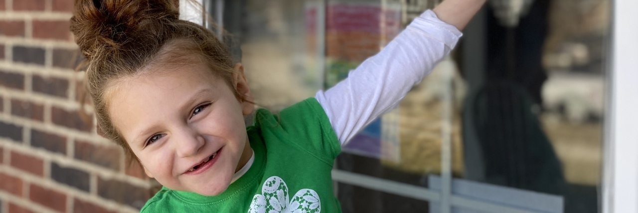 Navigating the COVID-19 Pandemic When Your Child Has a Rare Disease Brie Oest-Rader's daughter by the window.