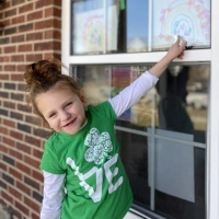 Brie Oest-Rader's daughter by the window.