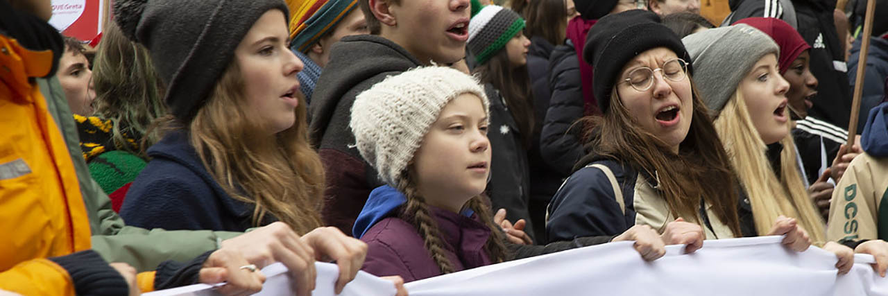 Greta Thunberg Shuts Down Columnist Bolt's 'Deeply Disturbing' Insults Greta Thunberg walks in a march while holding a banner