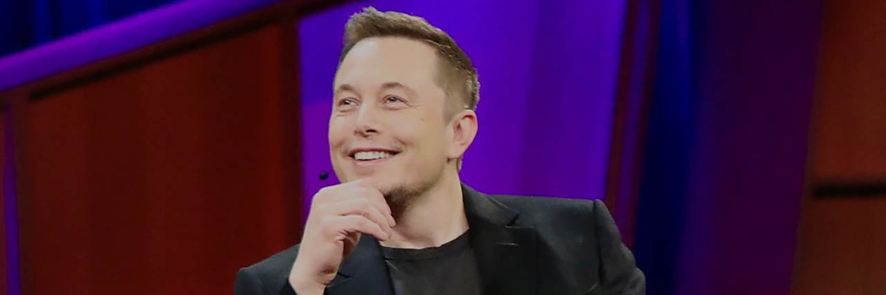 A photo of Elon Musk talking onstage
