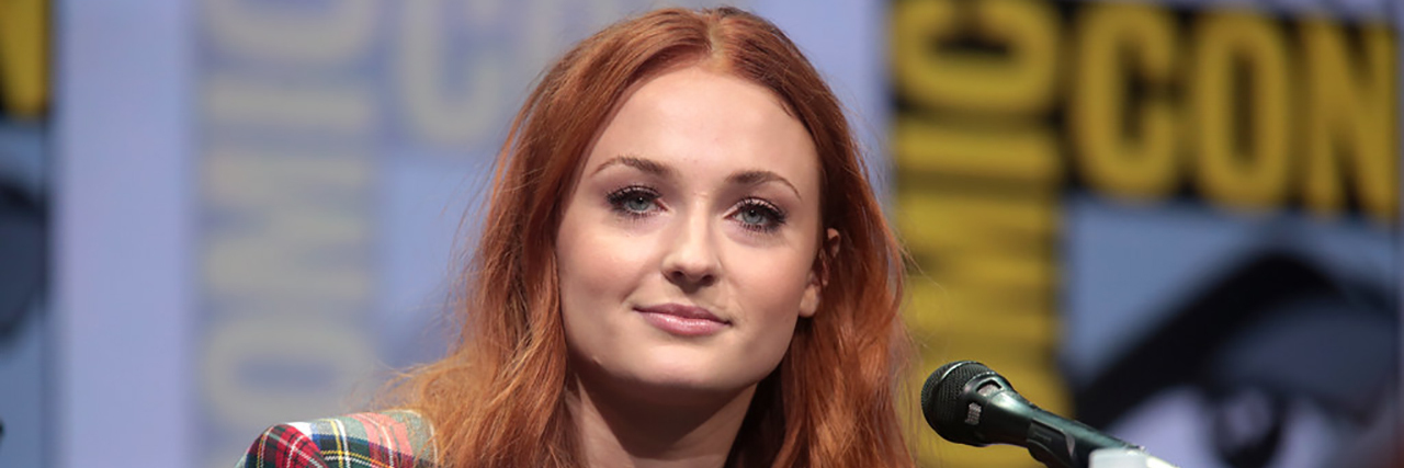 Sophie Turner Responds to Piers Morgan Ignorant Mental Illness Comment Sophie Turner looks ahead while sitting on a panel