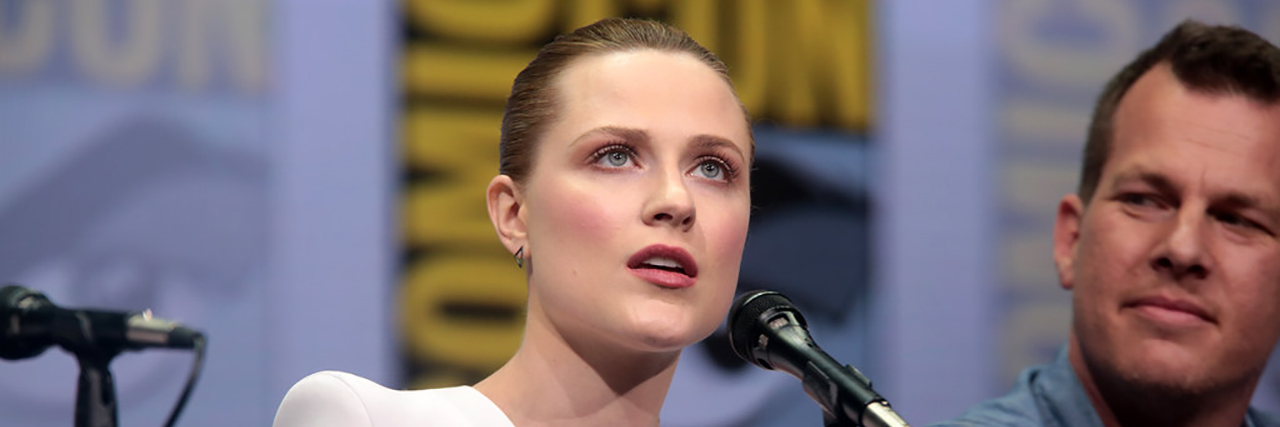 Evan Rachel Wood Shares Why She Went to Psychiatric Hospital at Age 22 Evan Rachel Wood speaking at a panel at ComicCon