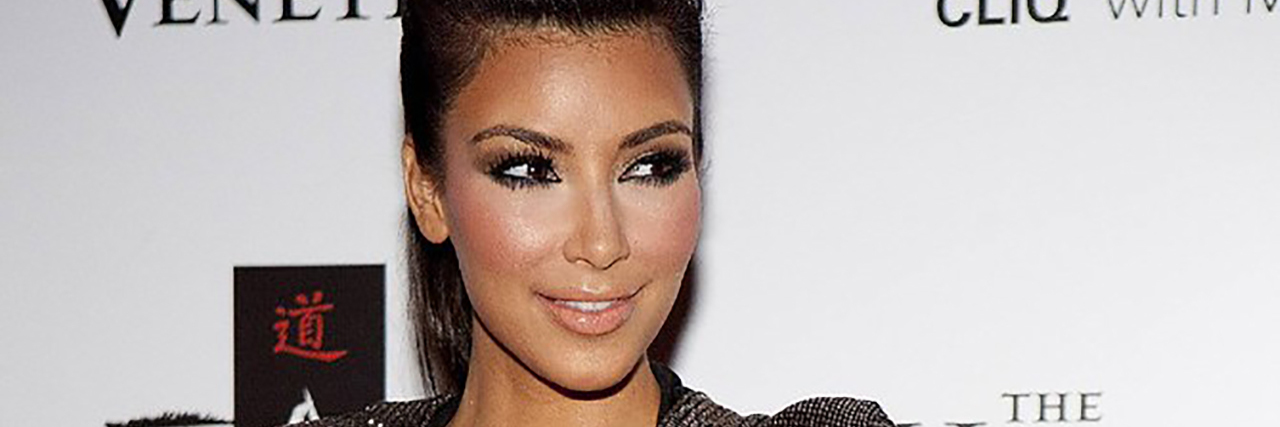 Kim Kardashian wearing a sparkly gown at fashion week