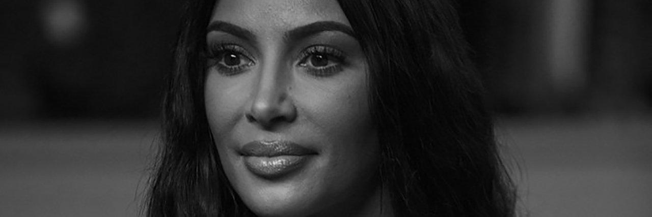 A black and white photo of Kim Kardashian