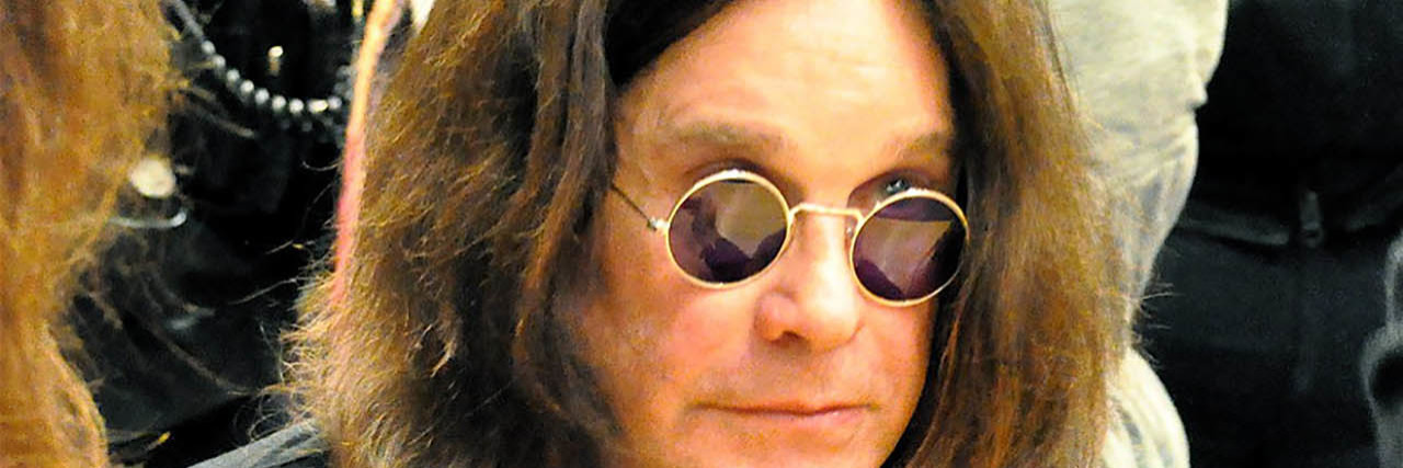 Ozzy Osbourne Shares Parkinson's Disease Diagnosis A picture of Ozzy Osbourne surrounded by a crowd