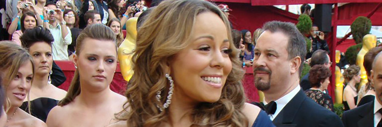 Mariah Carey smiles on the red carpet
