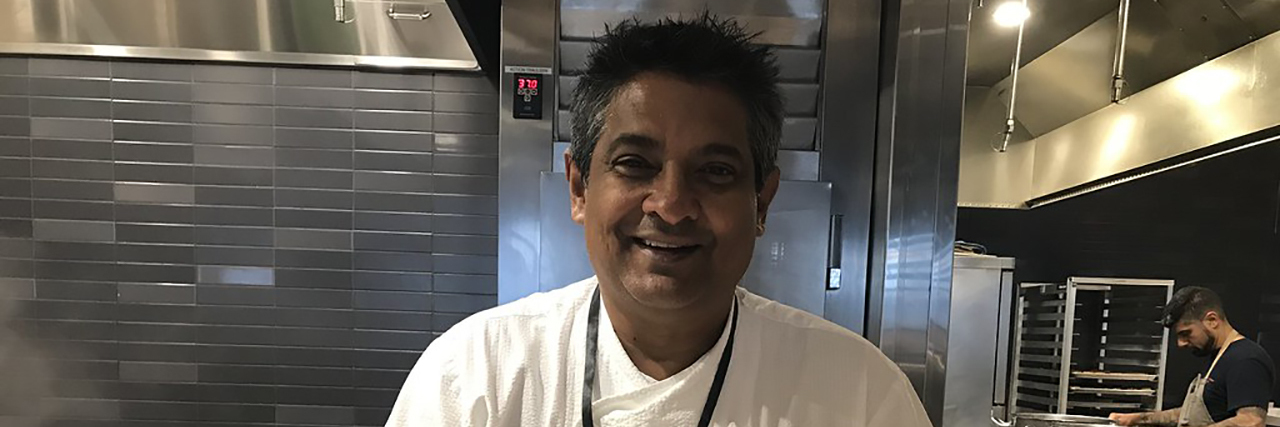 A photo of late Floyd Cardoz in the kitchen