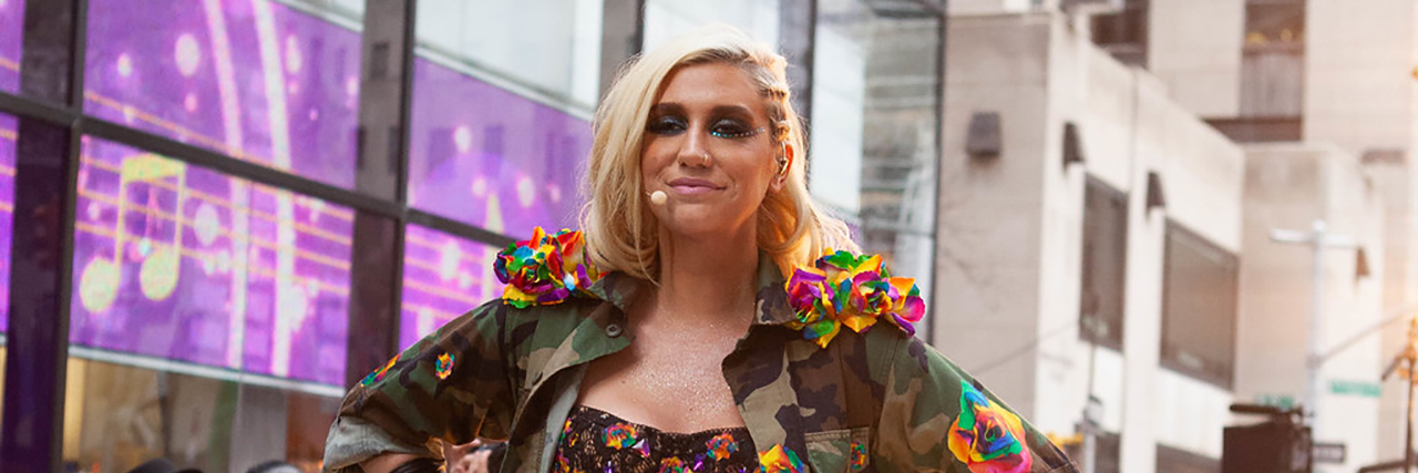 Kesha Writes About Anxiety and Depression in Teen Vogue Essay Kesha poses in a bodysuit while perfoming outside