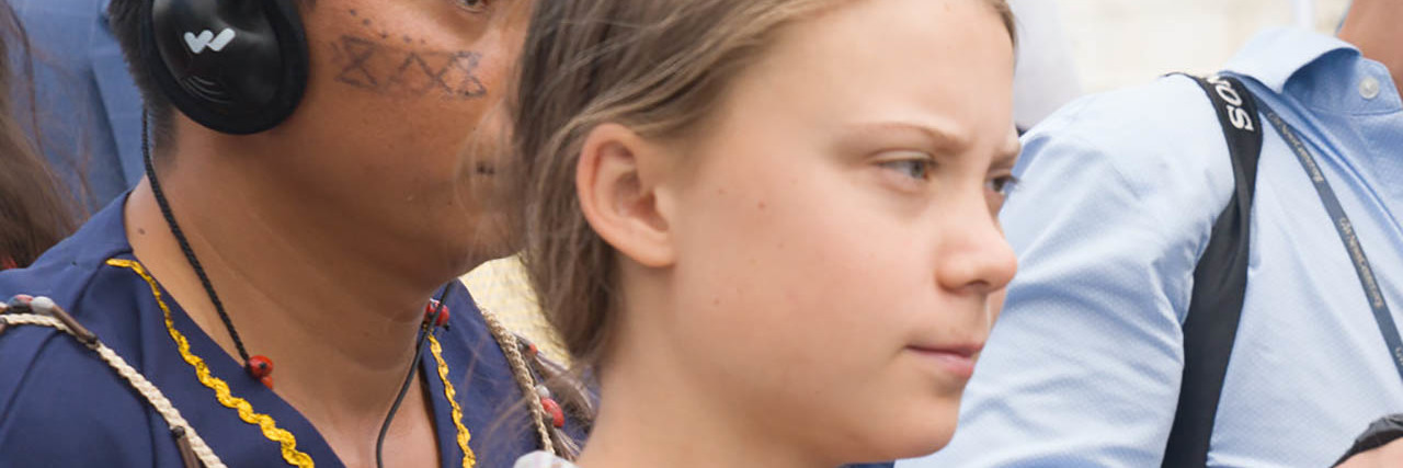 How Greta Thunberg Turned Depression Into Environmental Activism Greta Thunberg looks ahead while at a rally