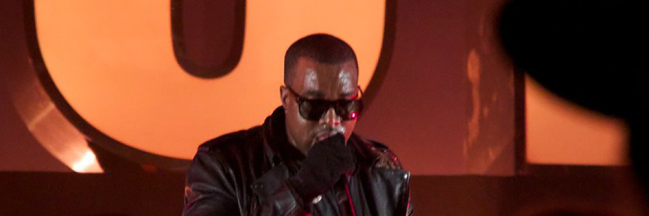 Kanye West performing in all-black