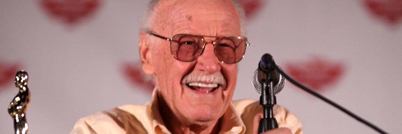 Marvel Comics Legend Stan Lee Dies at 95 Stan Lee smiles while accepting an award and giving a speech at an event