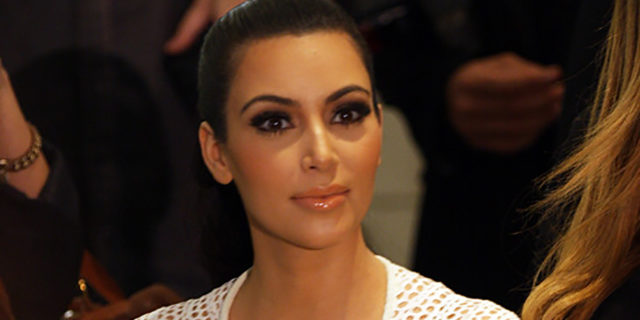 Kim Kardashian wearing a white dress at fashion week