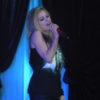 Avril Lavigne sings while wearing a black outfit