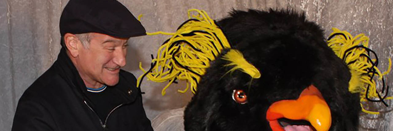 Robin Williams' Daughter Has a Message for Those With Depression Robin Williams poses with someone in a bird costume