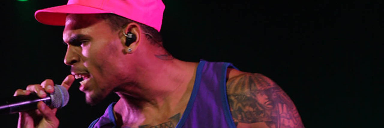 The Message Chris Brown's Grammy Nomination Sends to Trauma Survivors Chris Brown performing onstage