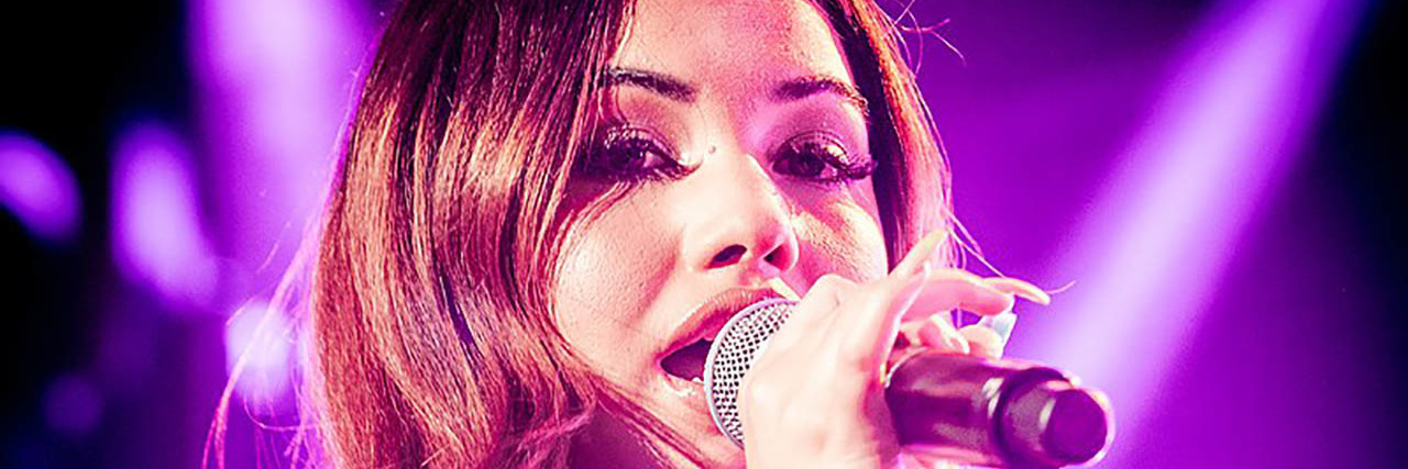 Mabel's Song 'Loneliest Time of Year' Is About Christmas Loneliness The singer Mabel perfoming onstage