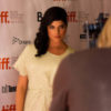 Selma Blair poses in a white sparkly dress on the red carpet