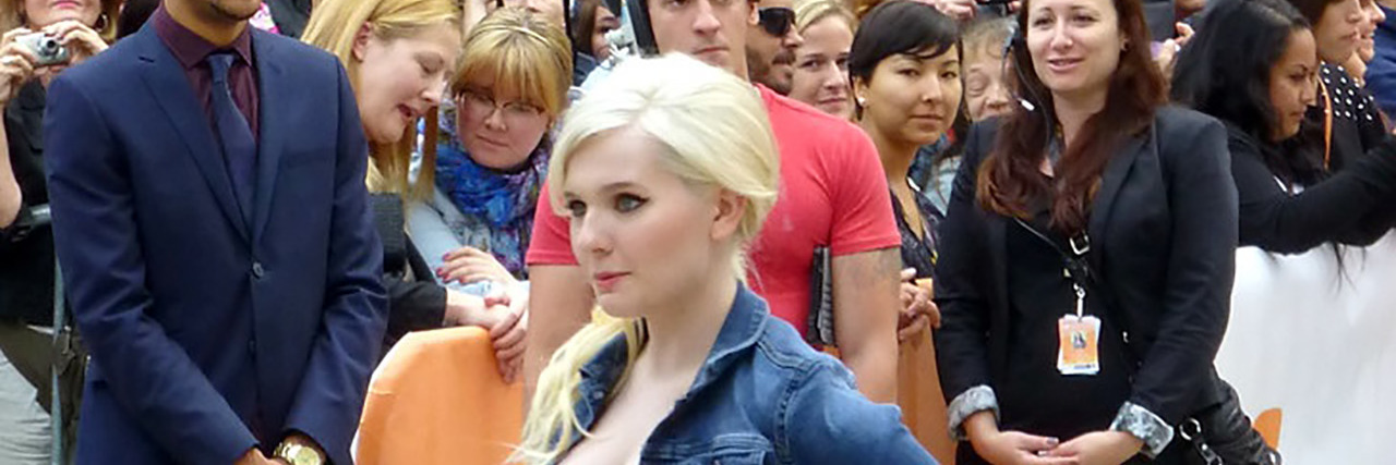 Abigail Breslin Shares She Is a Domestic and Sexual Violence Survivor Abigail Breslin on the red carpet