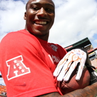 Miami Dolphins wide receiver Brandon Marshall smiles after making a reception during pregame warm up at the Aloha Stadium during National Football League's 2012 Pro Bowl game in Honolulu, Hawaii, Jan. 29, 2012.